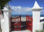 The red gates of the cathedral that leads to the sea in Cockburn town on Grand Turk island (Turks &amp; Caicos).