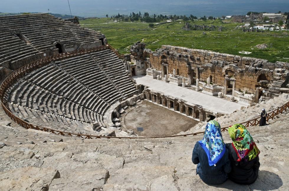 PAMUKKALE, TURKEY - APRIL 17: Two unidentified women visit the ancient theater of the Roman city of Hierapolis on April 17, 2009 in Pamukkale, Turkey. The site is a UNESCO World Heritage site.; Shutterstock ID 152128088; Project/Title: Photo Database Top 2