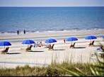 Hilton Head Island, South Carolina beach landscape - rental umbrellas, bikes and chairs.