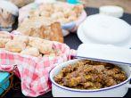 Fresh roasted bread and mutton kebabs in dishes on a table