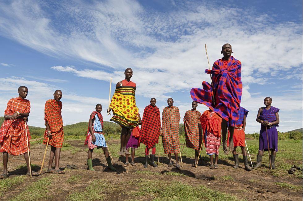 MASAI MARA, KENYA - DECEMBER 2: Unidentified Masai warriors dance and participate in traditional jumps as part of a cultural ceremony on December 2, 2011 in Masai Mara National Park, Masai Mara, Kenya