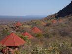 WATERBERG, NAMIBIA - JULY 24, 2013: Red roofs of the Waterberg Plateau Lodge in Namibia nestling high on the slope of Waterberg with views across the endless Kalahari.  ; Shutterstock ID 194748248; Project/Title: Namibia; Downloader: Fodor's Travel