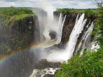 Rainbow over Victoria Falls on Zambezi River, border of Zambia and Zimbabwe; 