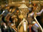 A Golden Kinnari statue at the Grand Palace Bangkok, Thailand