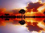 Beautiful African sunset reflected in water, in the Kruger National Park, South Africa; 