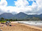 Hanalei Bay Beach in Kauai, Hawaii. A public beach where people go to swim and surf.