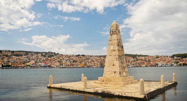Obelisk - a symbol of freedom. Port of Argostoli, Kefalonia, Greece; 
